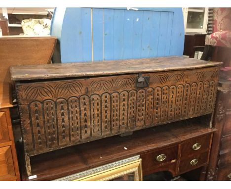 Antique oak and elm coffer with carved decoration to front panel Condition report: Top warped, some worm damage overall - sou