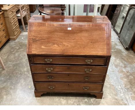 George III fruitwood bureau over four long graduated drawers on bracket feet measurements H102cm W91.5cm D48cm