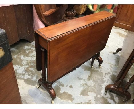 Victorian mahogany Sutherland table on turned legs with ceramic casters