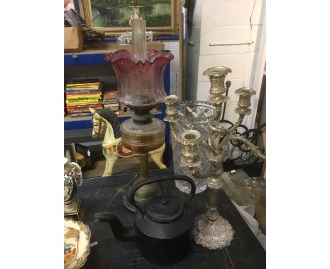 Brass oil lamp with glass shade, together with a Queen Anne style candelabra, iron kettle and a large cut glass vaseCondition