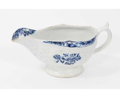 A Lowestoft blue and white sauceboat, circa 1770, with floral decoration and moulding, 17cm longCondition report: Light fritt