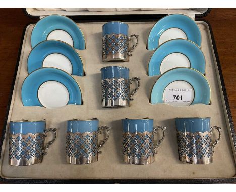 Early 20th century Aynsley coffee set on turquoise ground with pierced silver cup holders (Sheffield 1917), in original fitte