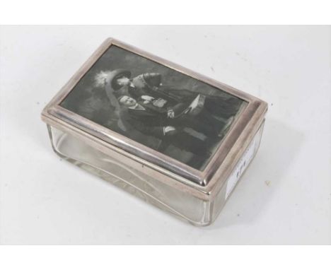 George V silver topped glass box, rectangular form with star cut base, the silver mounted glazed top inset with photographic 
