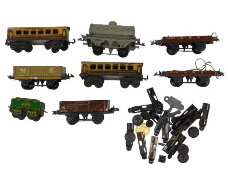 Various O gauge tinplate rolling stock, including a Royal Daylight tanker wagon, North Eastern plank wagon, LMS plank wagon, 
