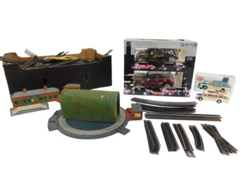 Railway track, remote control Minis, and Dinky Collection Mercedes Benz Omnibus. 