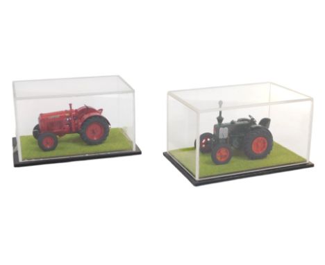 Diecast tractors, including a Marshall diesel tractor, and a McCormick-Deering tractor, in collector's cases. (2)