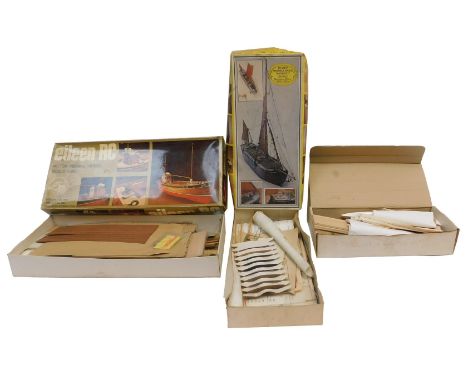 A group of wooden construction kits, comprising a Trilogy 6 Glider Kit, a Remploy Thames Spirit Sail Barge Kathleen, and an E