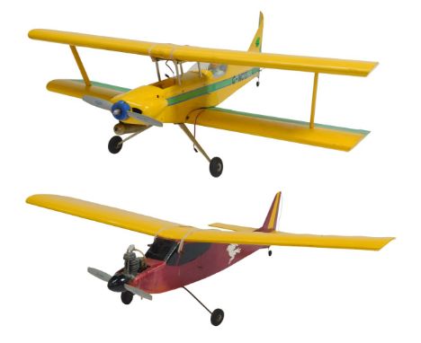 Two radio controlled model aircrafts. 