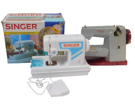 A Vulcan Classic battery operated sewing machine, and a Singer chain stitch battery operated sewing machine, boxed. (2)