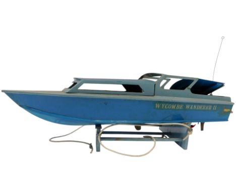 A radio controlled pond yacht, titled The Wycombe Wanderer II, 80cm long, on stand. 