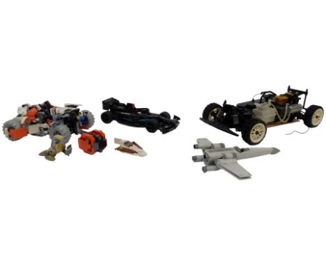 A Lego 42178 Surface Space Loader LT78, a Lego Technics Mercedes AMG F1 W14E Formula 1 car, a Kyosho Nitro remote control car