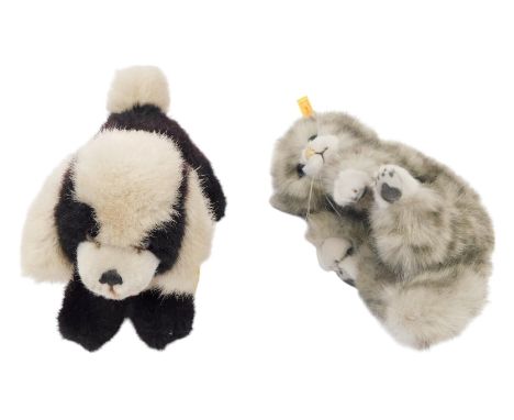 A Steiff cat and dog, comprising Drolly, 16cm high, and a recumbent Tabby cat, 10cm high. (2)