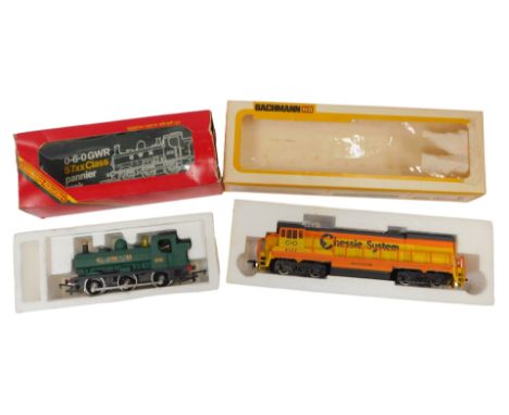 The Hornby GWR 0-6-0 pannier tank, OO gauge, and a Bachmann HO Chessie System locomotive. (2)