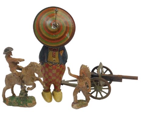 Four various toys, comprising a tinplate clown, cowboy, Indian, and a tinplate field gun. (4)
