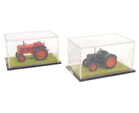 Diecast tractors, including a Nuffield 1060, and a Fordson tractor, in collector's cases. (2)