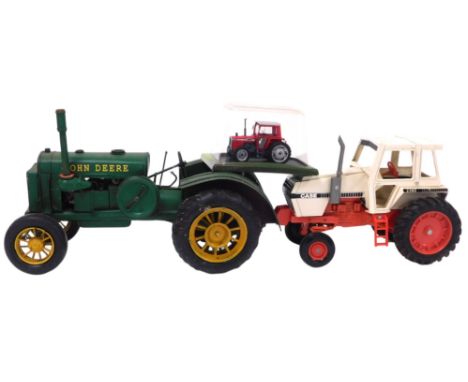 A tin plate model of a John Deere 1931 GP tractor, an Ertl diecast case tractor, and a Hachette Massey Ferguson 590 tractor, 