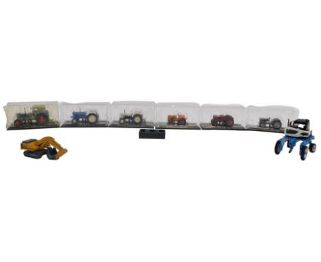 Atlas Editions collectable tractors, a Bobard 1:32 scale straddle tractor, and a Liebherr 974 diecast backhoe. (1 tray)