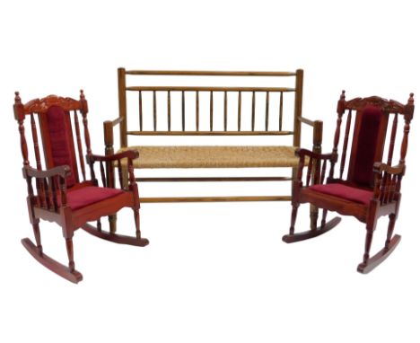 A miniature elm bench, with rush seat, 76cm wide, and two doll's rocking chairs.