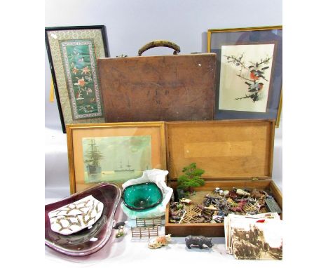 A leather bound trunk / suitcase containing miscellaneous effects to include a framed Chinese embroidery, 2 watercolours, 2 s