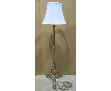 An Edwardian brass floor-standing standard lamp with scrolled mounts, 125cm high