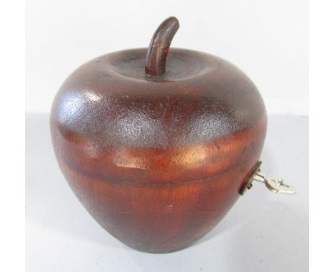 A Pear-wood fruit tea caddy with working lock and key. 