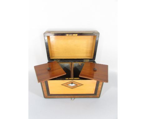 A Victorian satinwood and rosewood inlaid tea caddy with mother of pearl detail and two compartments to the interior with ori