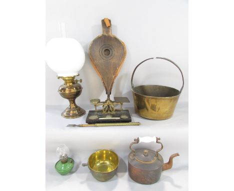 A miscellaneous collection of items including a jam pan, copper kettle, scales, bellows, oil lamps, etc