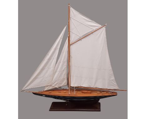 A large hand built model of a gaff rigged cutter/ sailing boat built in timber and well finished, with stand. Height 107cm