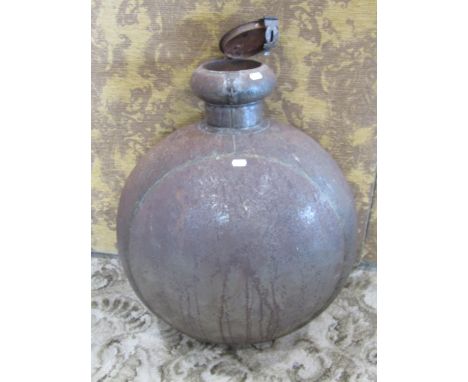 A large Indian circular metal work ‘moon’ flask with hinged cover, 70cm high