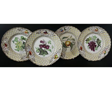 A set of four mid 19th century Minton dessert plates with hand painted sprays within lattice work borders 