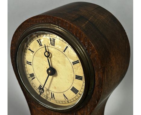 A small Edwardian inlaid oak balloon mantle clock, 21 cm high