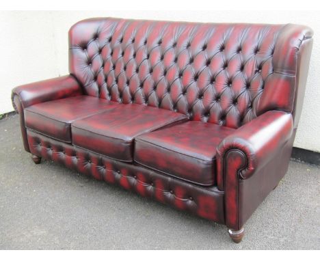 A Thomas Lloyd sofa high-backed club three seat sofa 