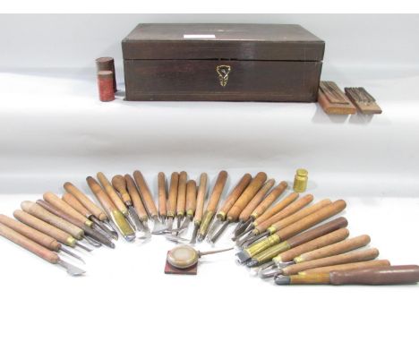 Thirty three vintage silver craft man’s chasing/engraving tools in an antique writing box. 