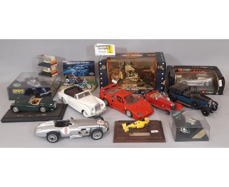 A collection of model vehicles including boxed Harley- Davidson Heritage Springer, boxed Damien Hill Williams Renault FW16 by