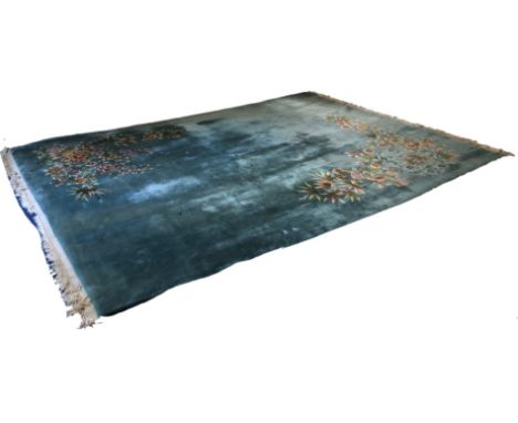 A large Chinese wool carpet with a  turquoise ground and floral corner decoration,  dimensions 385cm long x 278cm wide