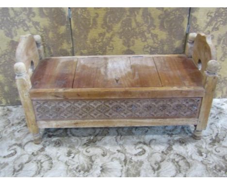 A small carved weathered teakwood box settle / commode, 55cm high, 97 x 40cm.