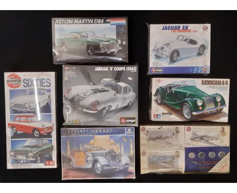 Six 1990's boxed model kits of classic cars by Airfix, Burago, Italeri, Monogram and Tamiya together with a box set of D-Day 