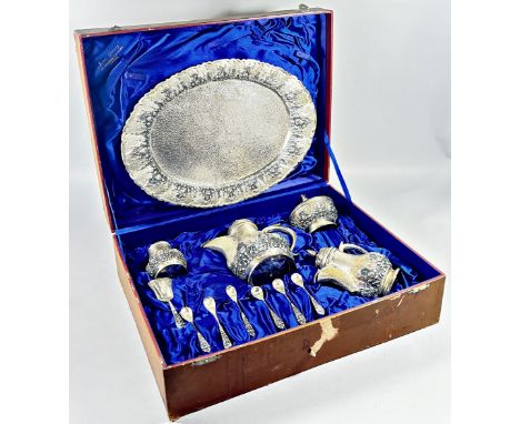 An Indonesian silver Arabic style tea and coffee service with two pots, sugar bowl, a caddy bowl, six teaspoons and a caddy s