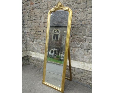 A large modern gilt framed cheval dressing mirror with easel back, 180 x 56cm.