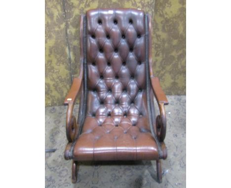A Regency style slipper chair with button leather upholstery