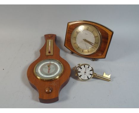 A Metamec Battery Driven Mantel Clock, Modern Wheel Barometer and Key Novelty Barometer
