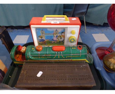 A Fisher Price Music Box TV, Tinplate Mountain Express Locomotive, Cribbage Box containing Dominoes Etc