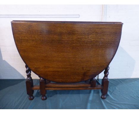 An Oak Oval Drop Leaf Barley Twist Gate Leg Dining Table. 89cm Long