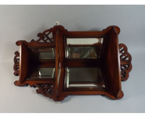 A Victorian Walnut Three Tier Wall Hanging Mirrored Corner Shelf with Pierced Decoration. 86cm High 