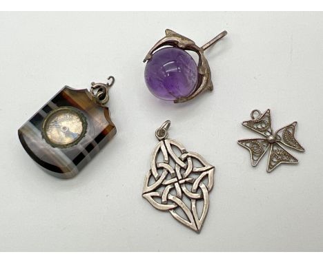 4 assorted pendants, to include silver. An amethyst ball with dolphin detail, small compass set in agate, filigree cross and 
