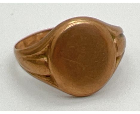 A vintage 9ct gold signet ring with empty oval cartouche and channelled detail to shoulders. Size Q, weight approx. 1.8g. 