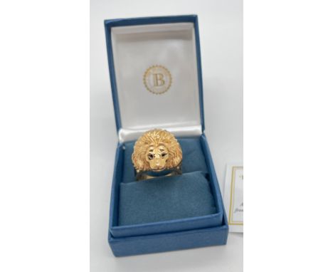 A boxed Bradford Exchange 24K gold plated stainless steel "Heart Of A Lion" men's dress ring. Lions head ring, eyes set with 