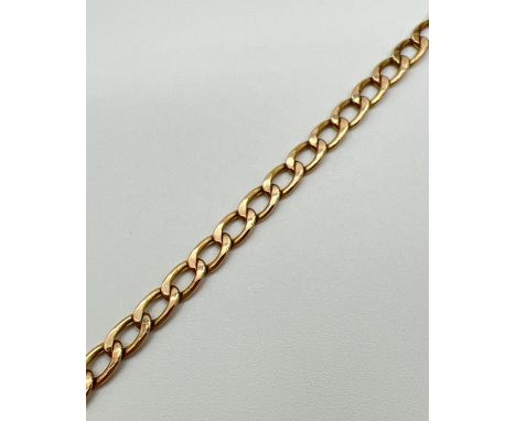 A 9ct gold 9" curb chain bracelet with spring ring clasp - clasp fixing ring missing. Gold marks to clasp and fixings. Approx