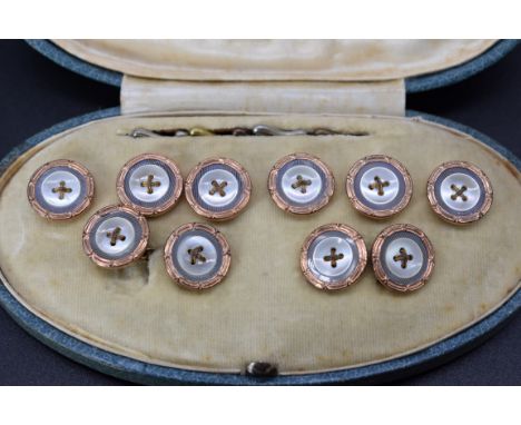 A cased set of vintage gold plated mother-of-pearl buttons and matching cufflinks. 