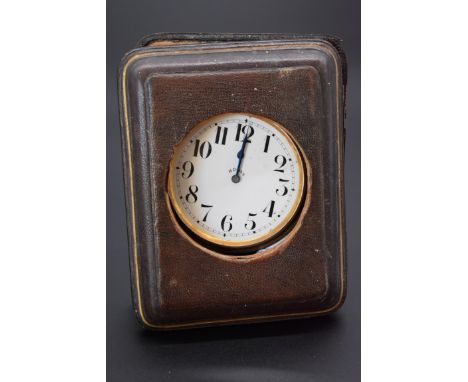 A vintage Swiss 8 day car clock, in fitted easel back case, having 6.5cm white enamel dial. 